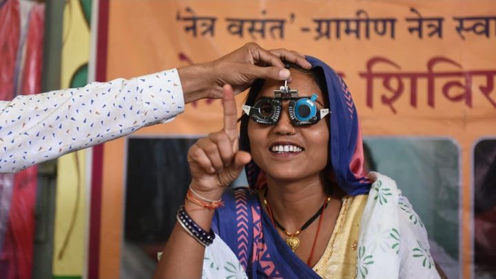Volunteering in Kolkata India providing vision aid campaign photo, 1 of 4