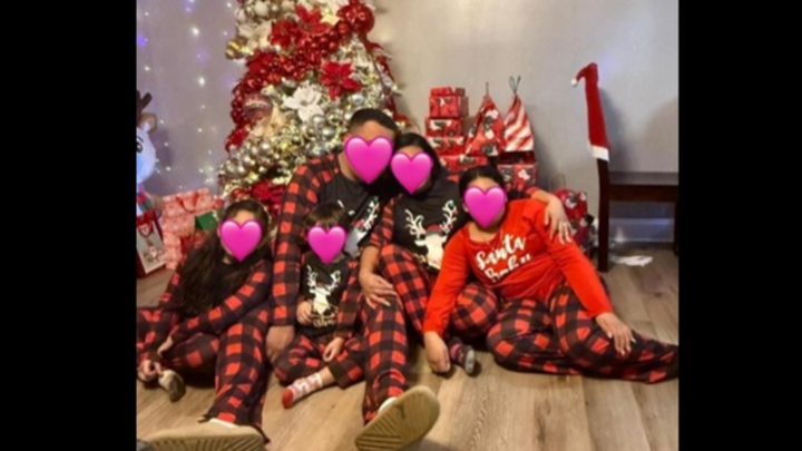 Stand with Iris's family after husband taken on Christmas campaign photo, 1 of 3