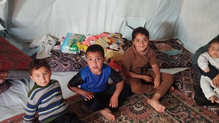 Family like yours living in tents, bombing, scarcity, fear. campaign photo, 1 of 7