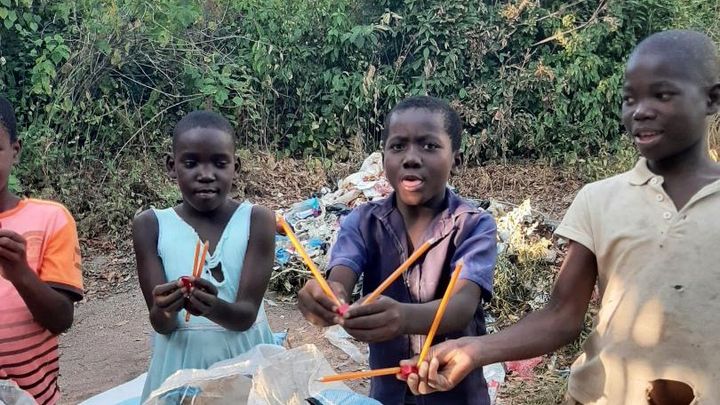 Planting mango trees and cleaning rubbish in Malawi.