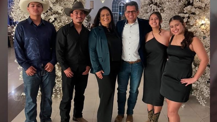Standing with Vanessa and her kids in their Time of Need campaign photo, 1 of 8